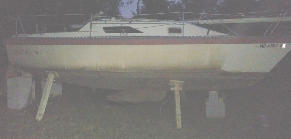 Sailboat on blocks needs cleaning